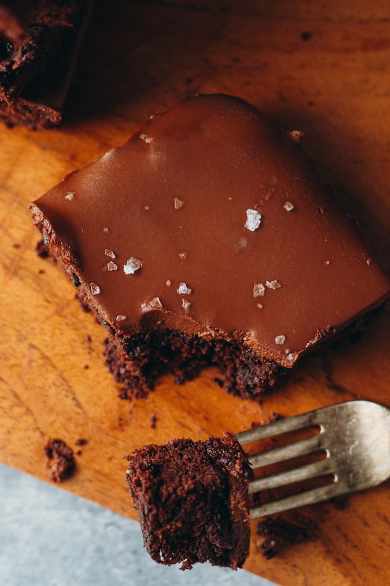 overhead shot of vegan zucchini brownie on cutting board