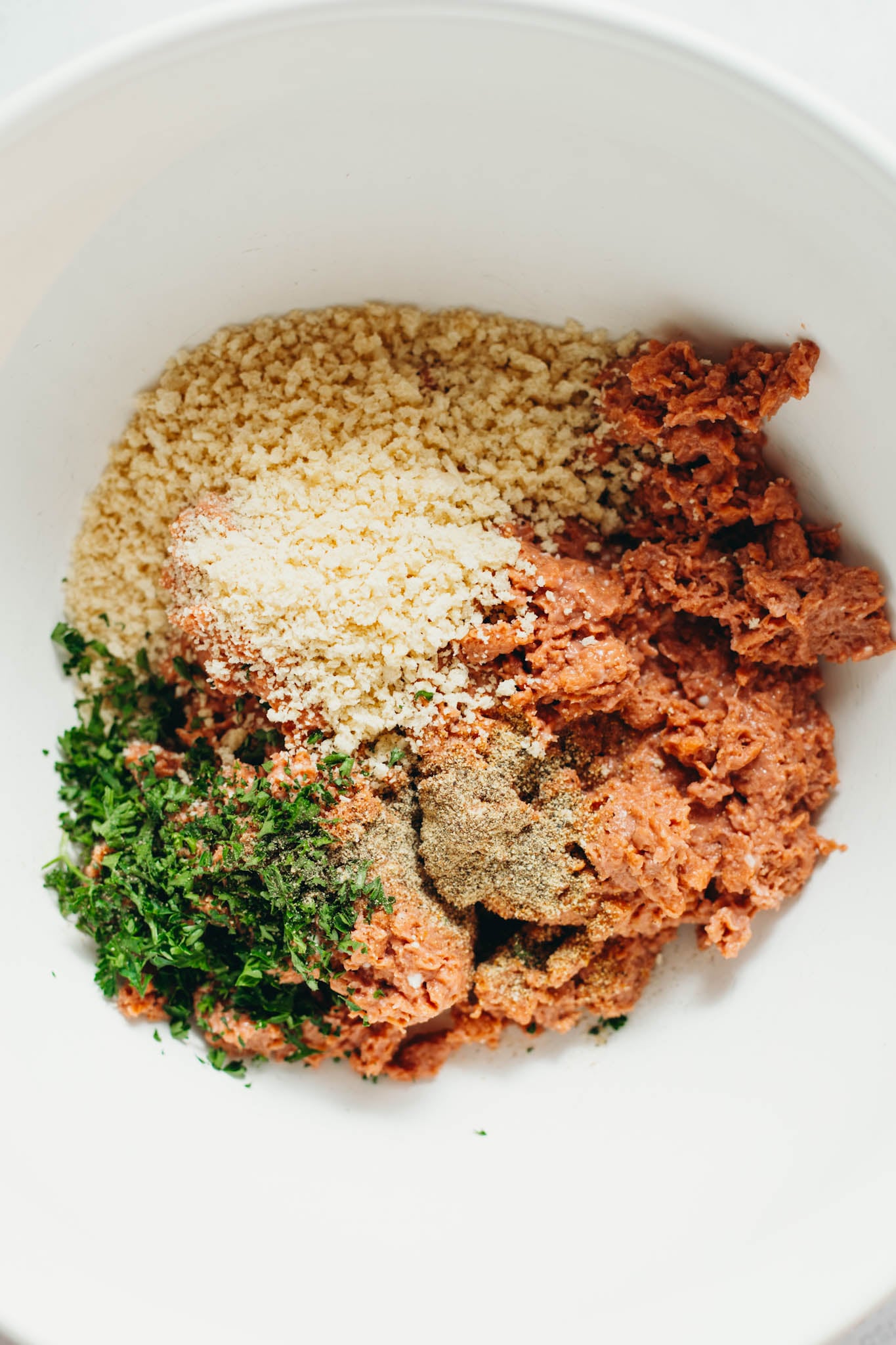 Photo of meatball ingredients in a bowl ready to be mixed