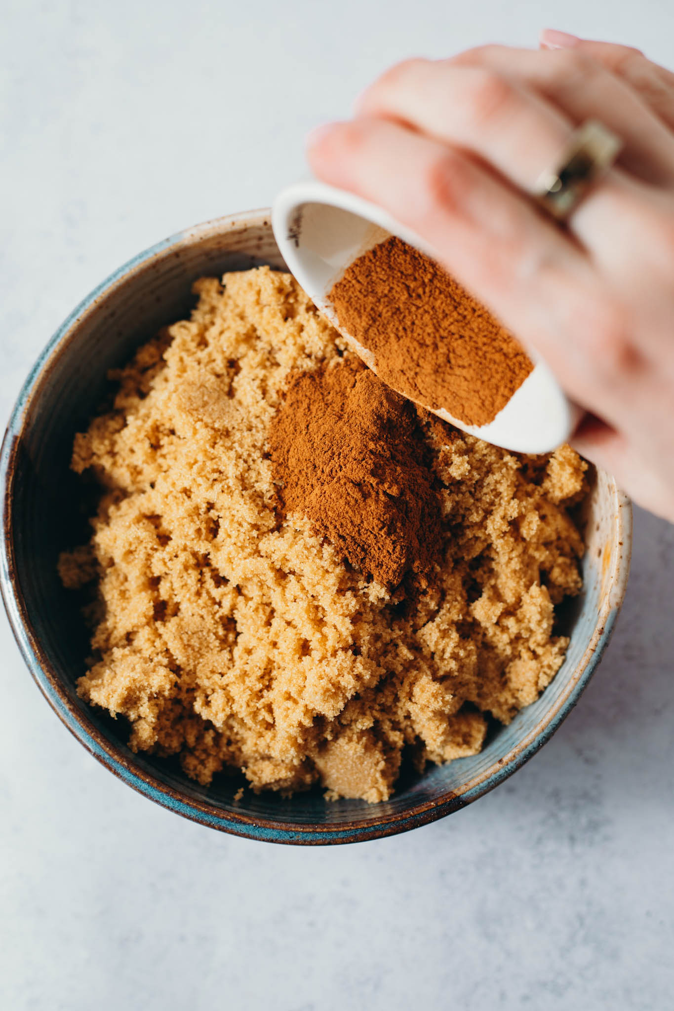 overhead view of cinnamon brown sugar being incorporated to create the filling and the topping.