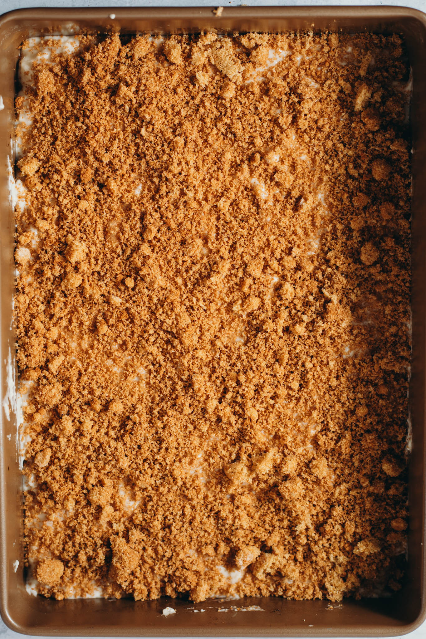 overhead view of coffee cake fully assembled before baking on a tray.