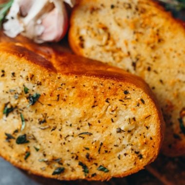 food photography overhead of thick cut vegan garlic bread with golden brown edges
