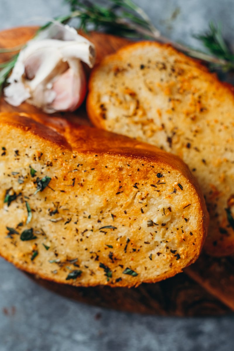 food photography overhead of thick cut vegan garlic bread with golden brown edges