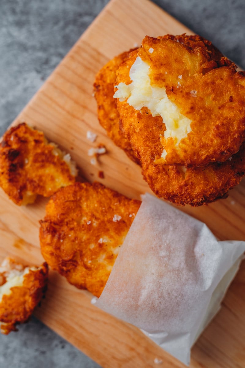 overhead of salted and deep fried McDonald's Hashbrowns Stacked on top of each other