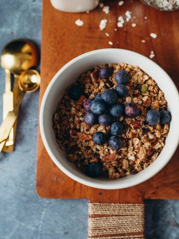 overhead of vegan granola in a bowl with blueberries
