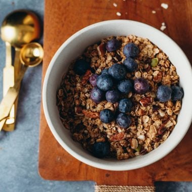 overhead of vegan granola in a bowl with blueberries