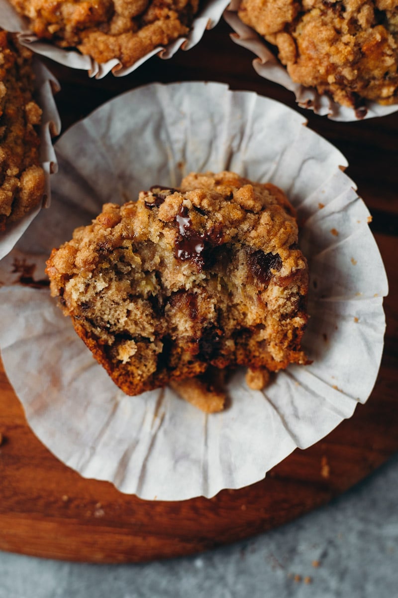 close up of vegan banana date muffin with bite out of it