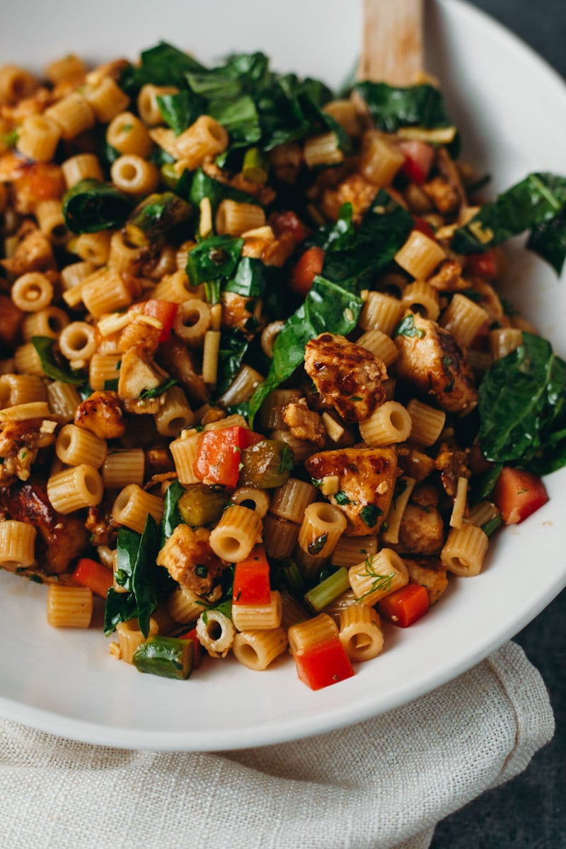 close up shot of vegan herb balsamic pasta salad in a serving bowl
