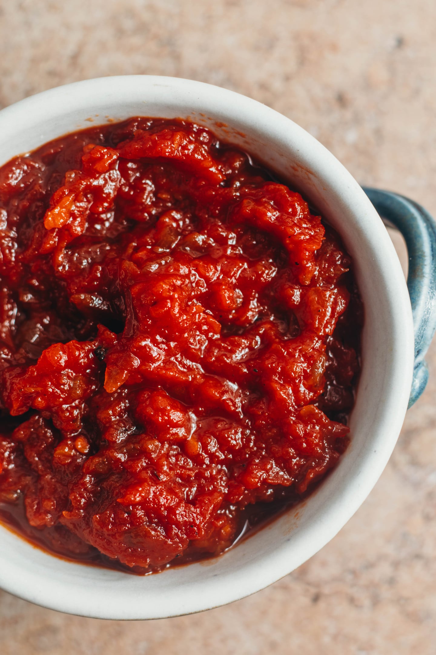 overhead view of tomato jam in a cup