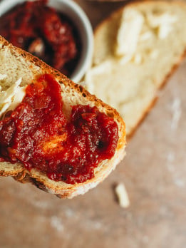 overhead view of tomato jam spread on toast.